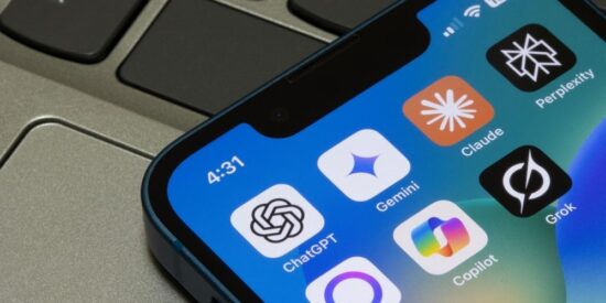 claude ai tools on iphone next to computer